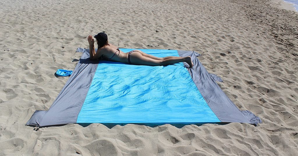 Woman Lying On Caracal Outfitters Blanket