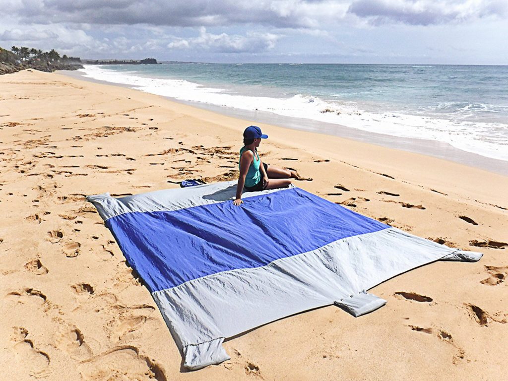 Woman Lying On Wildhorn Outfitters Beach Blanket